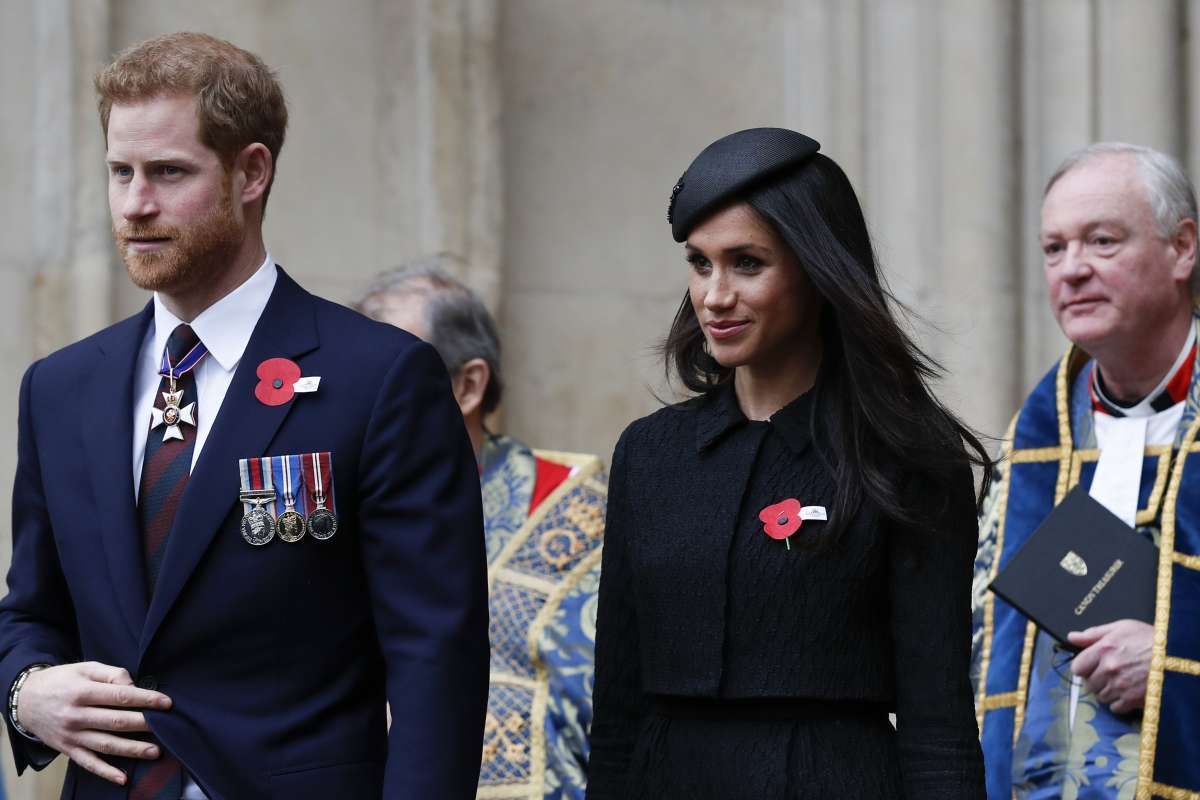 Britain's Prince Harry (L) and his fiancee US actress Meghan Markle (R) walk with each as they leave after attending a service of commemoration and thanksgiving to mark Anzac Day in Westminster Abbey in London on April 25, 2018.
Anzac Day marks the anniversary of the first major military action fought by Australian and New Zealand forces during the First World War. The Australian and New Zealand Army Corps (ANZAC) landed at Gallipoli in Turkey during World War I. / AFP PHOTO / Adrian DENNIS