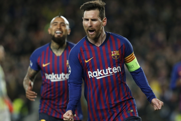 Barcelona's Argentinian forward Lionel Messi celebrates after scoring during the UEFA Champions League round of 16, second leg football match between FC Barcelona and Olympique Lyonnais at the Camp Nou stadium in Barcelona on March 13, 2019. (Photo by PAU BARRENA / AFP)