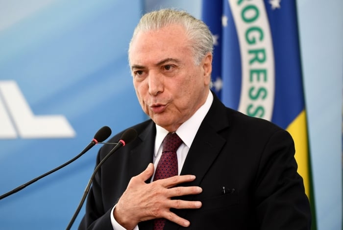 (FILES) In this file photo taken on April 27, 2018 Brazilian President Michel Temer delivers a statement to defend himself and his family from allegations of corruption, at Planalto Palace in Brasilia. - Brazil's ex-president Michel Temer was arrested on March 21, 2019 as part of a sprawling anti-corruption probe that has already claimed dozens of political and corporate scalps, media reports said. (Photo by EVARISTO SA / AFP)