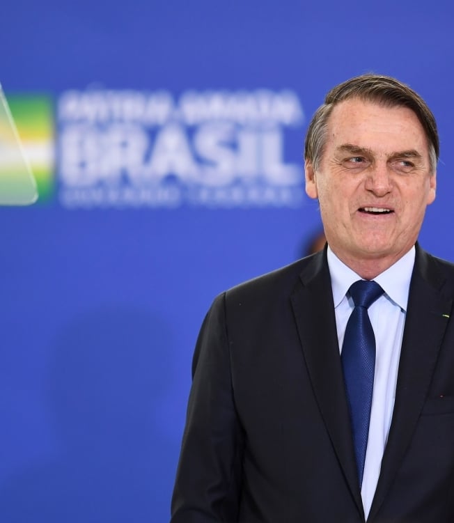 'Todo mundo aqui j&aacute; teve um parente ou amigo que se perdeu', afirmou Bolsonaro ao comentar as mortes pela Covid-19 - AFP