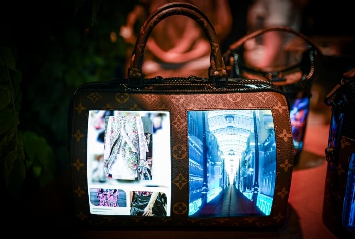 A Louis Vuitton bag with a flexible lcd screen is displayed during the Vivatech startups and innovation fair, in Paris on May 17, 2019. (Photo by Philippe LOPEZ / AFP)