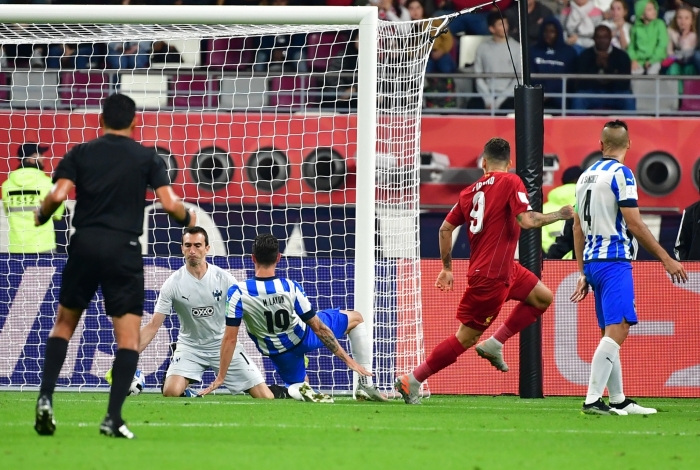 Liverpool's Brazilian midfielder Roberto Firmino (2nd-R) scores during the 2019 FIFA Club World Cup semi-final football match between Mexico's Monterrey and England's Liverpool at the Khalifa International Stadium in the Qatari capital Doha on December 18, 2019. (Photo by Giuseppe CACACE / AFP)