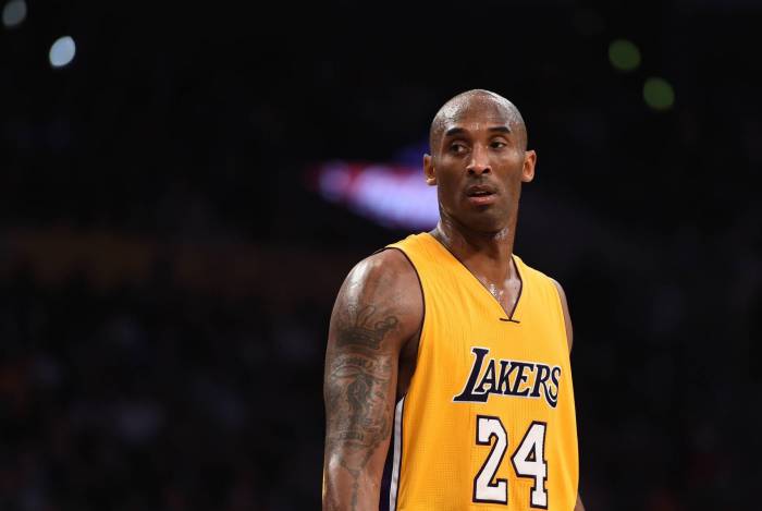 (FILES) In this file photo taken on November 21, 2015 Kobe Bryant (24) of the Los Angeles Lakers looks on during the Lakers NBA match up with the Toronto Raptors,at Staples Center in Los Angeles, California. - According to multiple US media sources,  Kobe Bryant died in a helicopter crash in Calabasas, California on January 26, 2020. (Photo by Robyn BECK / AFP)