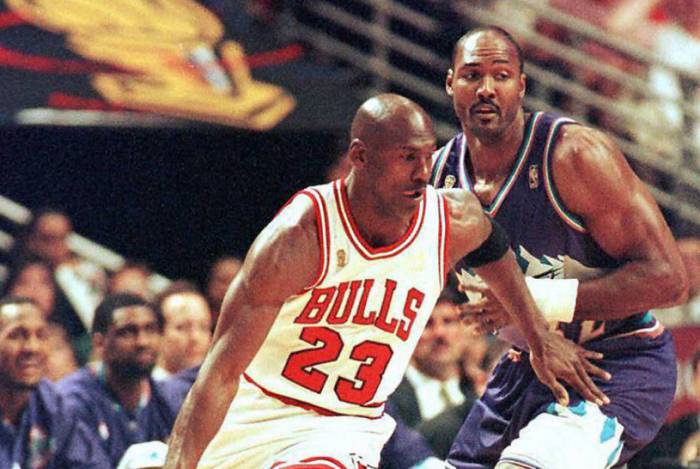 SALT LAKE CITY, UT - JUNE 13:  Michael Jordan (L) of the Chicago Bulls is defended by Karl Malone of the Utah Jazz 13 June during game six of the 1997 NBA Finals at the United Center in Chicago, IL.  (Photo credit should read VINCENT LAFORET/AFP via Getty Images)