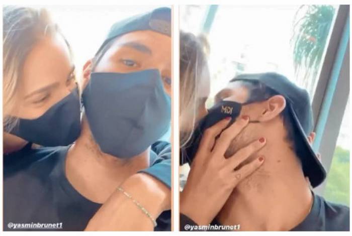 Gabriel Medina e Yasmin Brunet se divertem dando beijo de máscara
