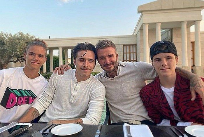 David Beckham e os seus filhos, Romeo, Brooklyn, e Cruz 
