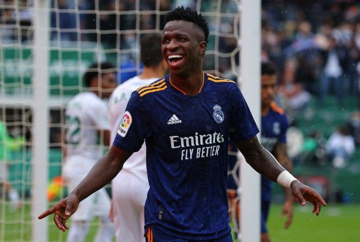 Real Madrid's Brazilian forward Vinicius Junior celebrates after scoring his team's second goal during the Spanish League football match between Elche CF and Real Madrid CF at the Martinez Valero stadium in Elche on October 30, 2021. (Photo by JOSE JORDAN / AFP)