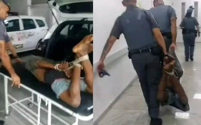 Policiais carregando homem amarrado na UPA
